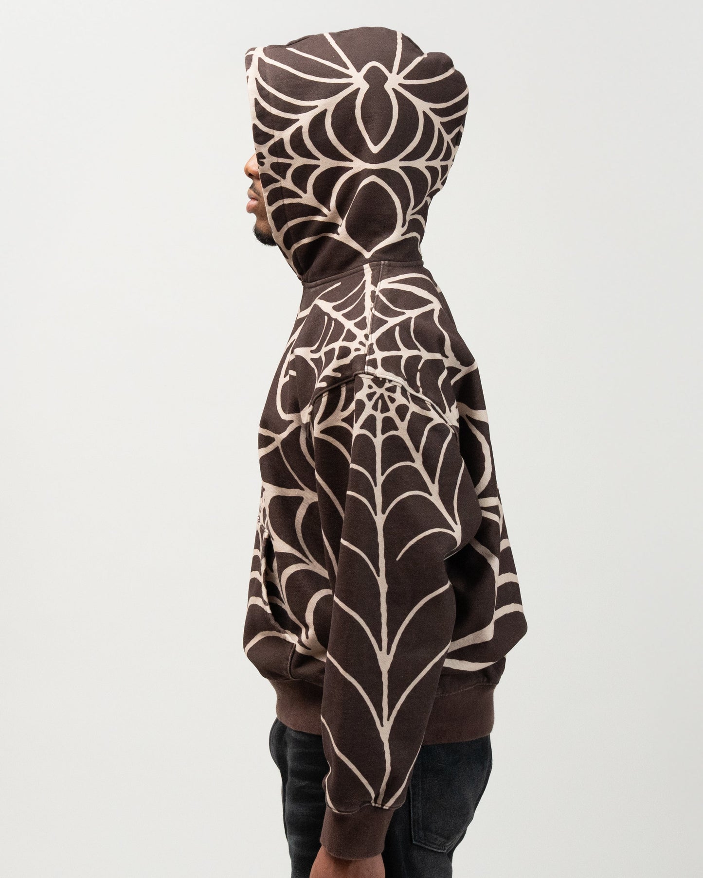 medium side angle of the spider hoodie. from the knees up showcasing the full side profile of the hoodie. j3t spider hoodie halloween