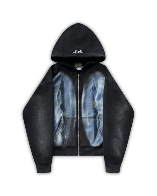 Flat lay image of the dogfight zip up. Two large oval print of fighter jets is visible on both side of the zipper. The hoodie is black and has vintage wash and distressing. J3T