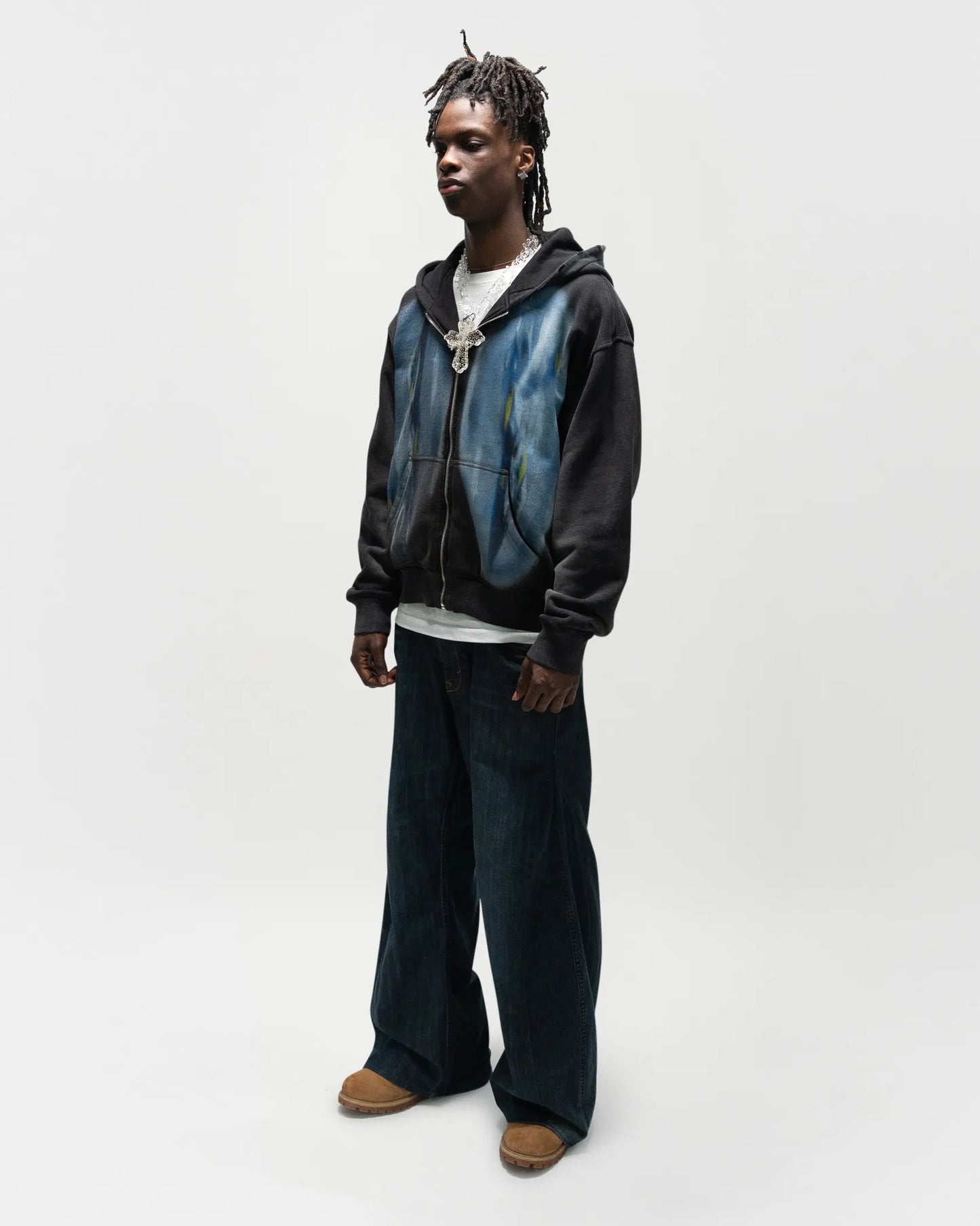 Black male model wearing the dogfight zip up by jet. This is a full body front/side view, 45 degree angle. everythingj3t