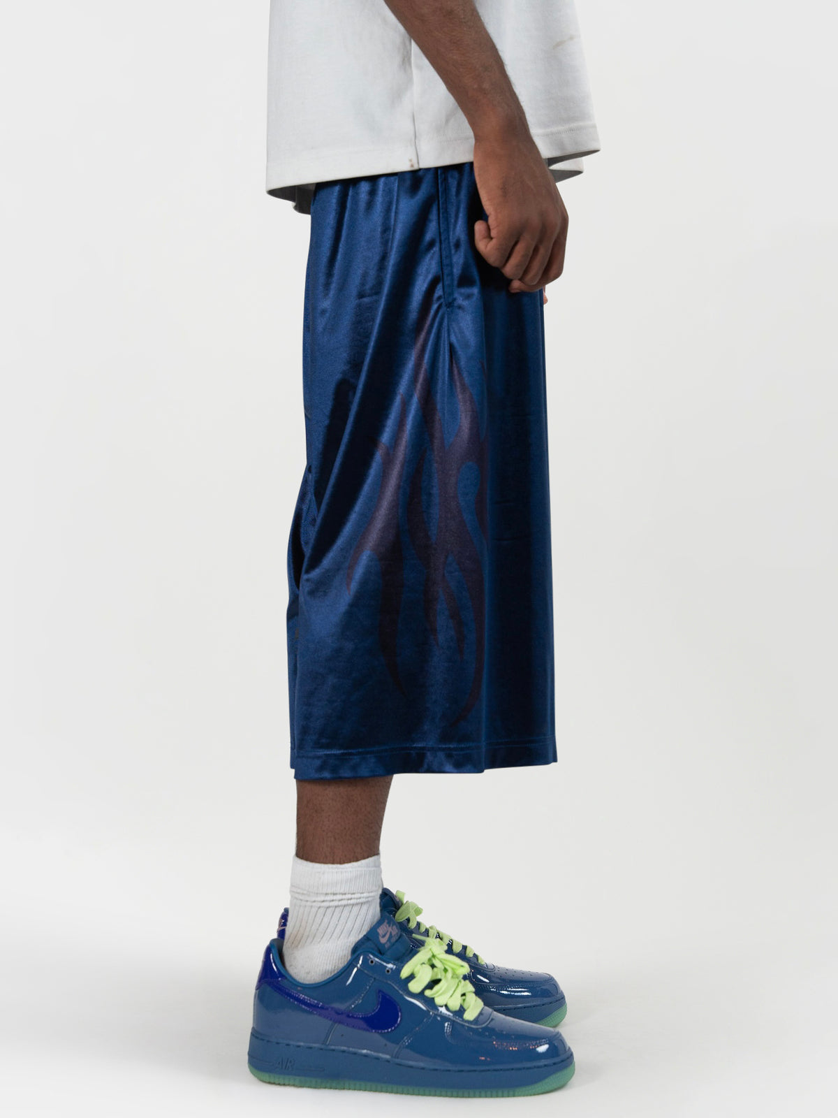 close up side angle of the tyson shorts. the image starts right above his waist, and showcases the large print on the side. everythingj3t