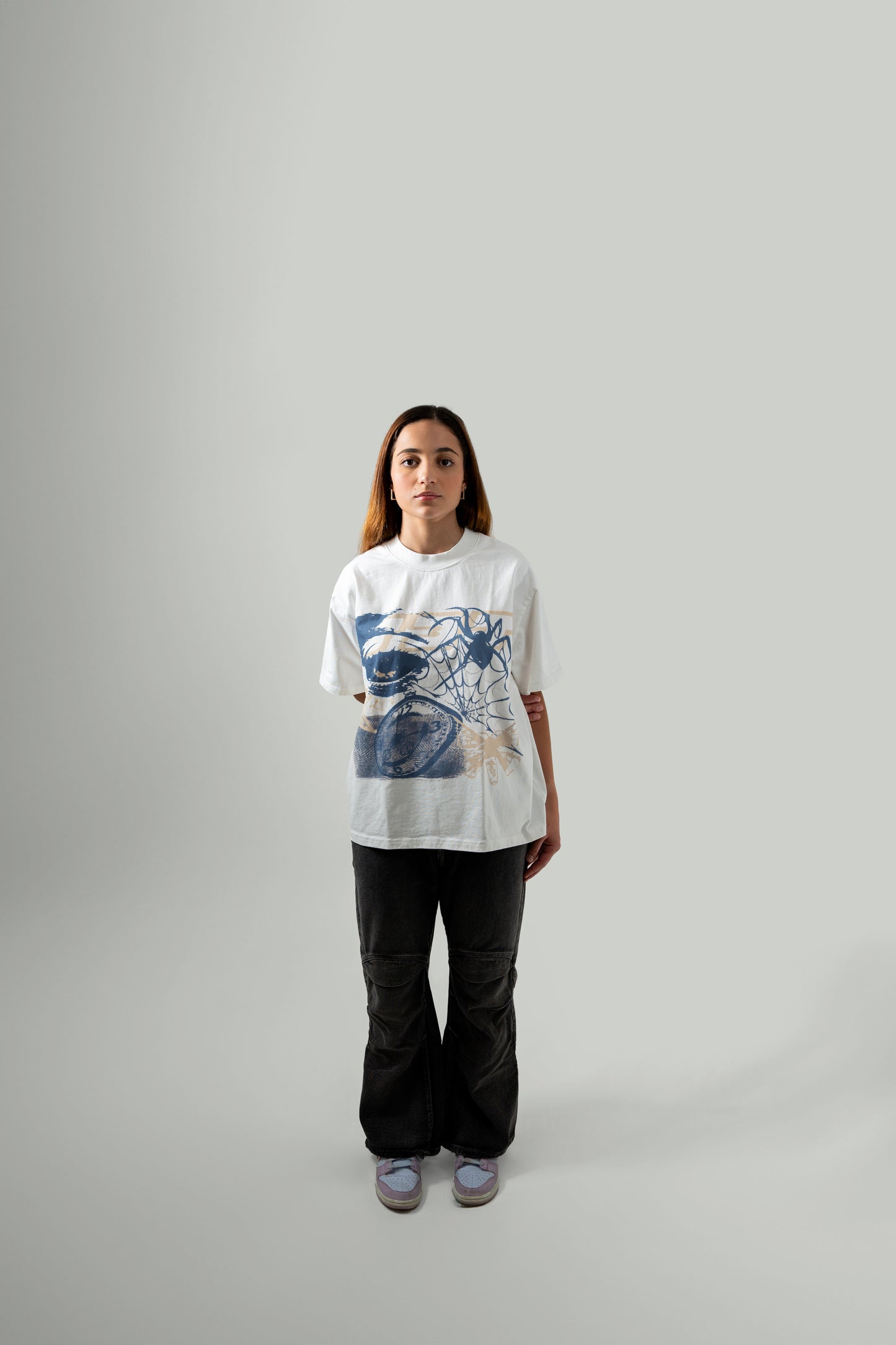 Front angle full body shot of female model wearing the flock tee in white