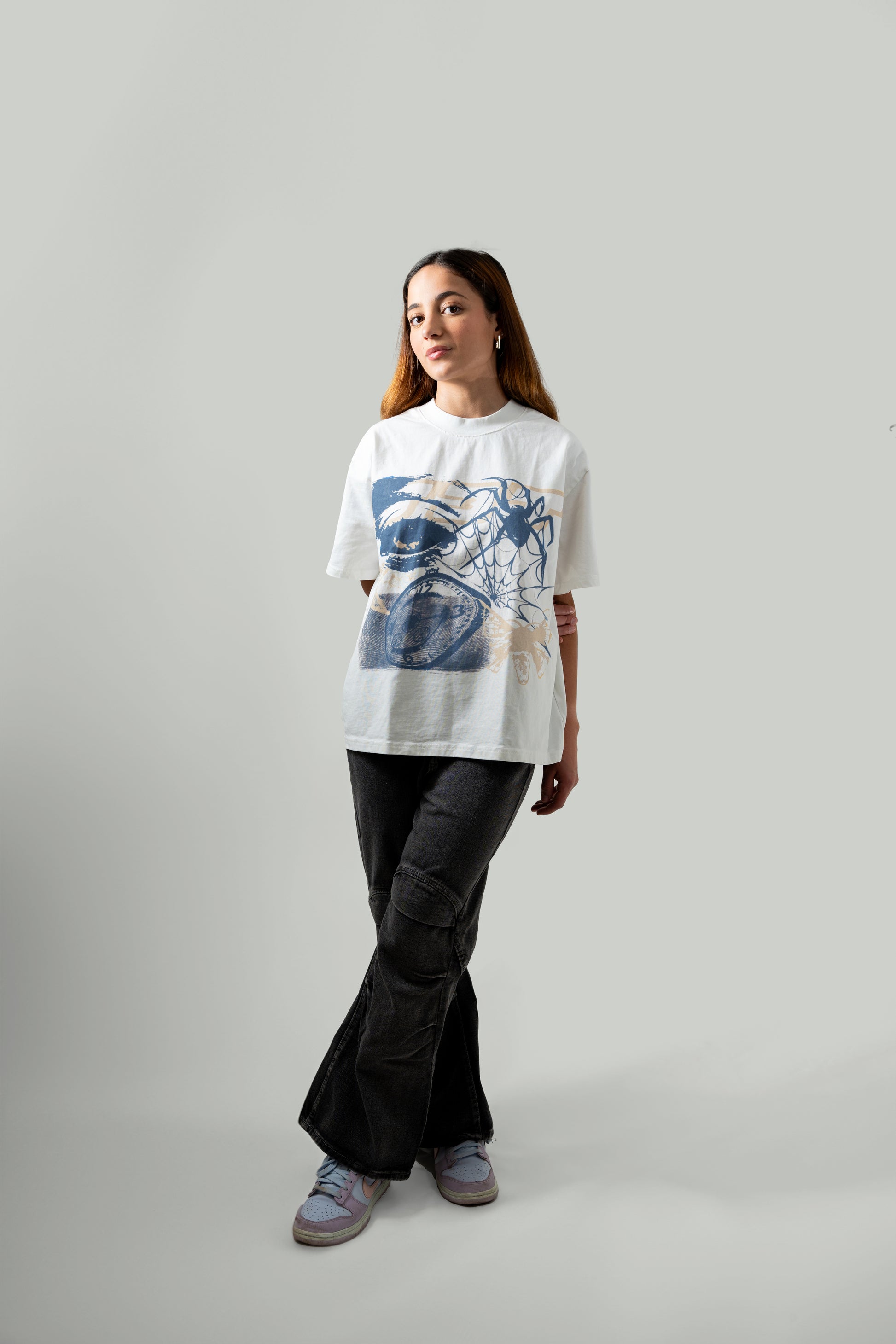 5'4" female model wearing white flock tee - front angle posing