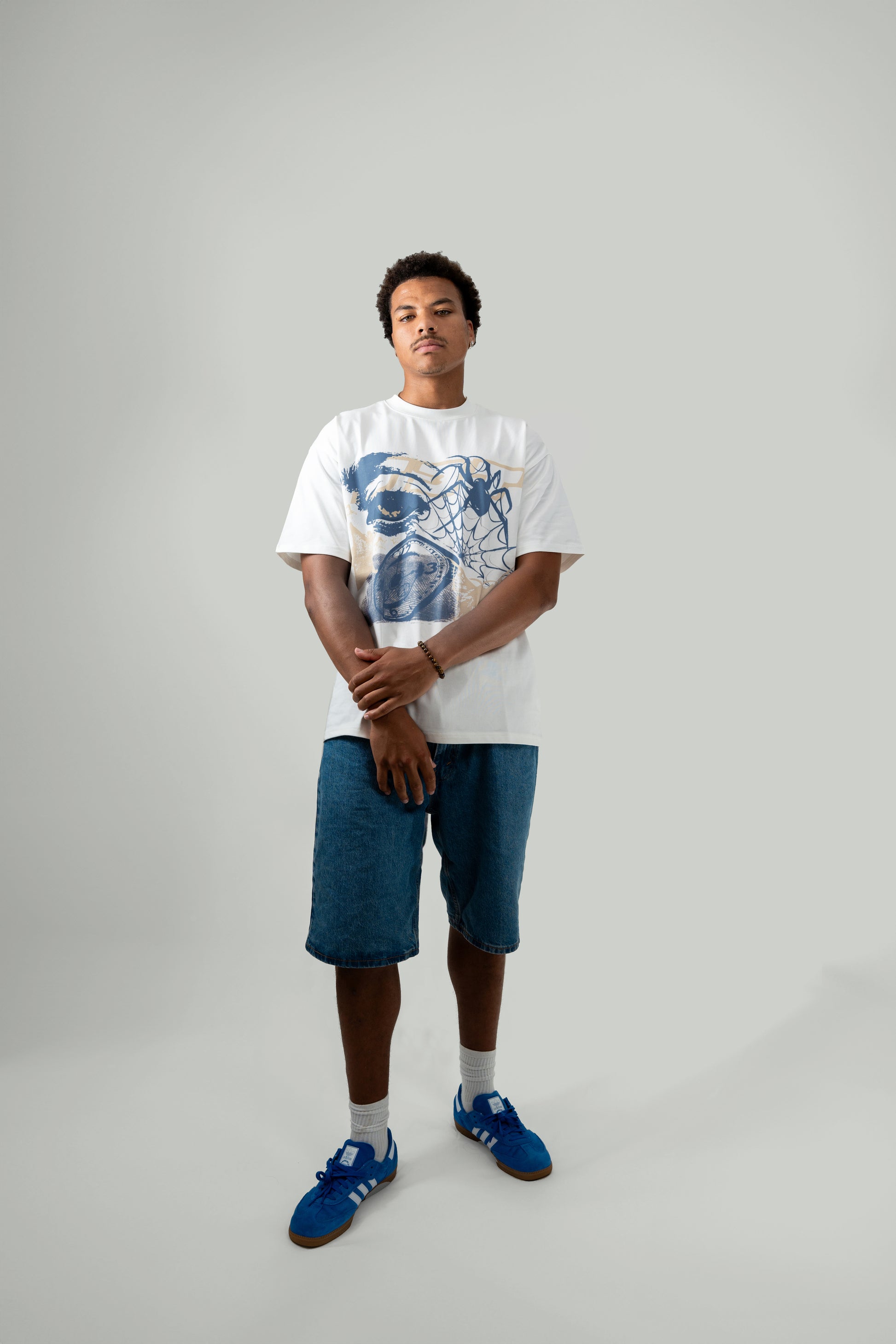 6'3" male model wearing flock tee - front angle posing