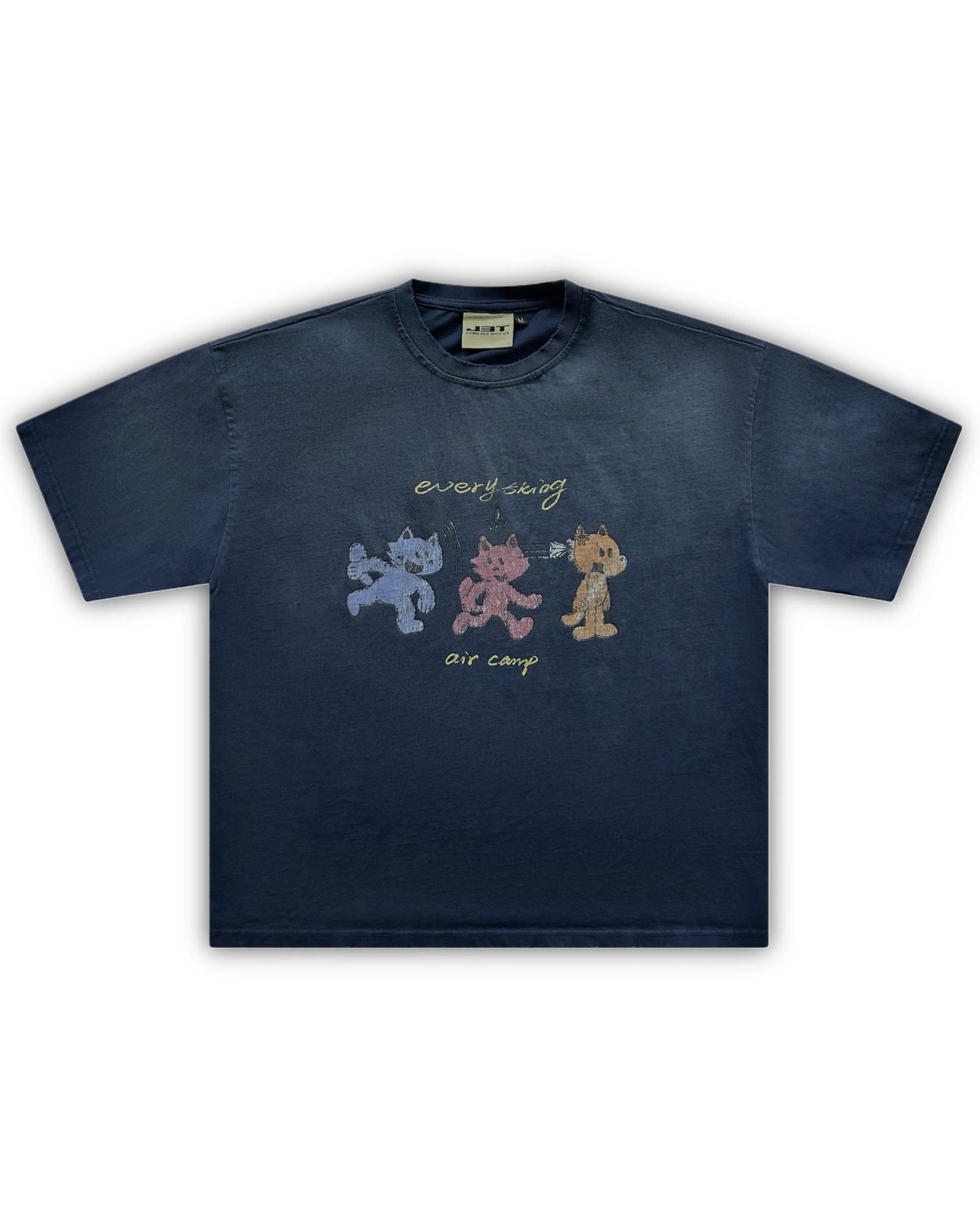 Flat lay image of the air camp tee by j3t. It is navy blue, featuring 3 wolf-like cartoon characters - blue, red and orange. above them is the text "everything". below them is the text "air camp"