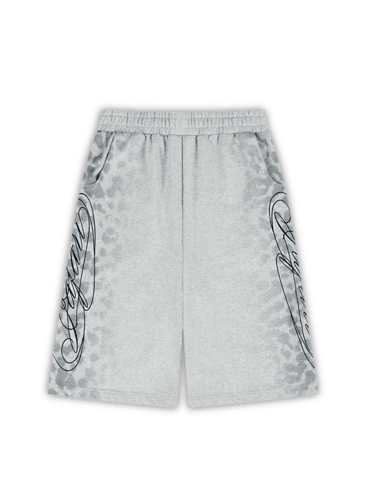 Flat lay angle of the jafari shorts. They are long enough to cover the knees. They have leopard printed patterns on each side, and a large jafari navy blue embroiderey on top of the prints. J3T